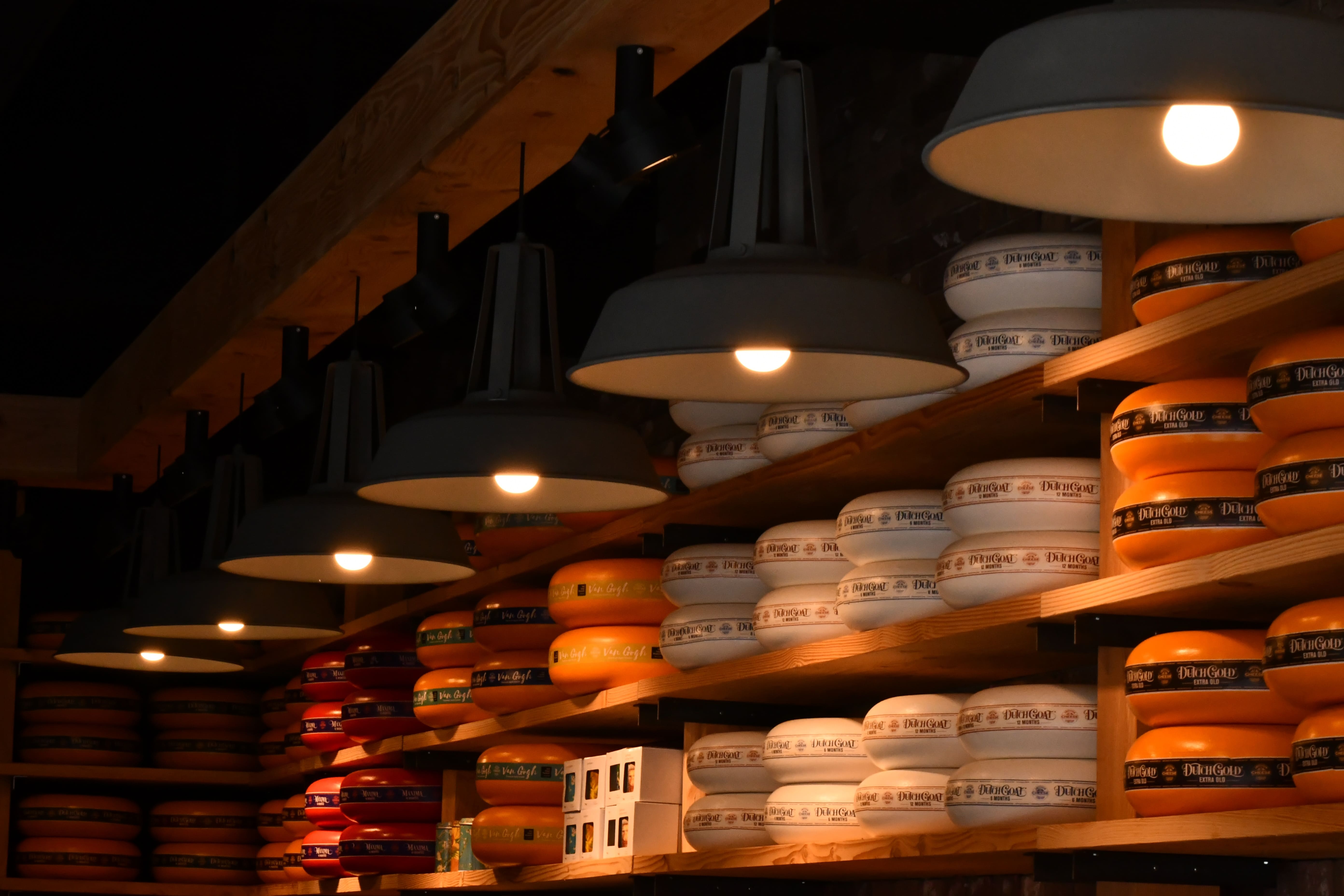 pendant lamps turned on near wall shelves