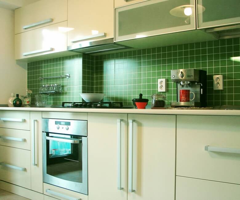 Modern-kitchen-furniture-with-green-tiles