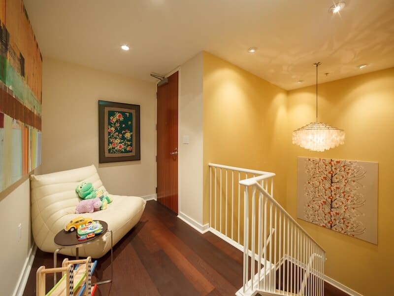 Yellow-accent-wall-and-white-stairs