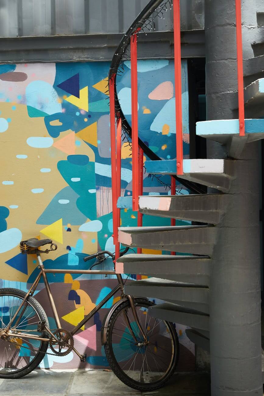 bicycle parked near colorful wall