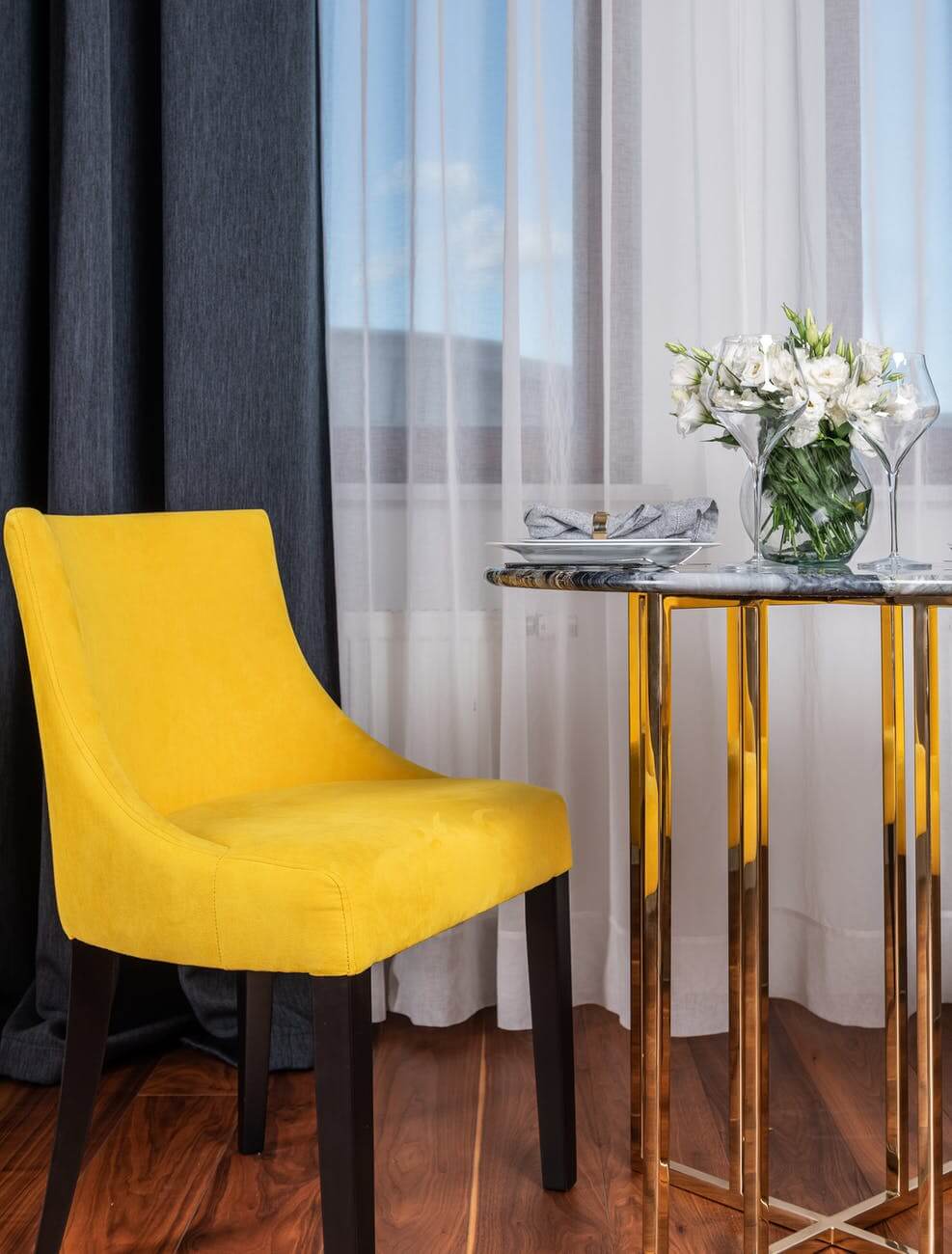 living room interior with stylish yellow chair and table