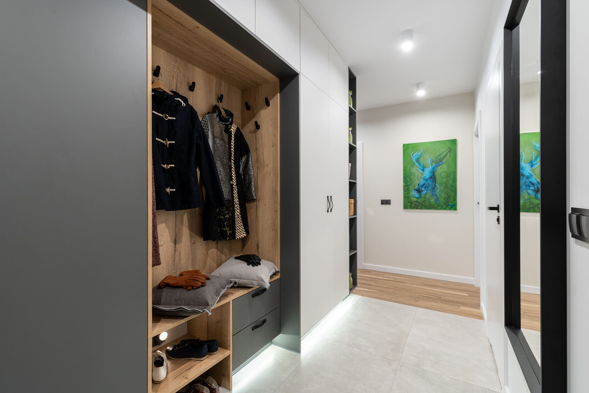 An organized and efficient mudroom with custom storage solutions and easy-to-clean flooring