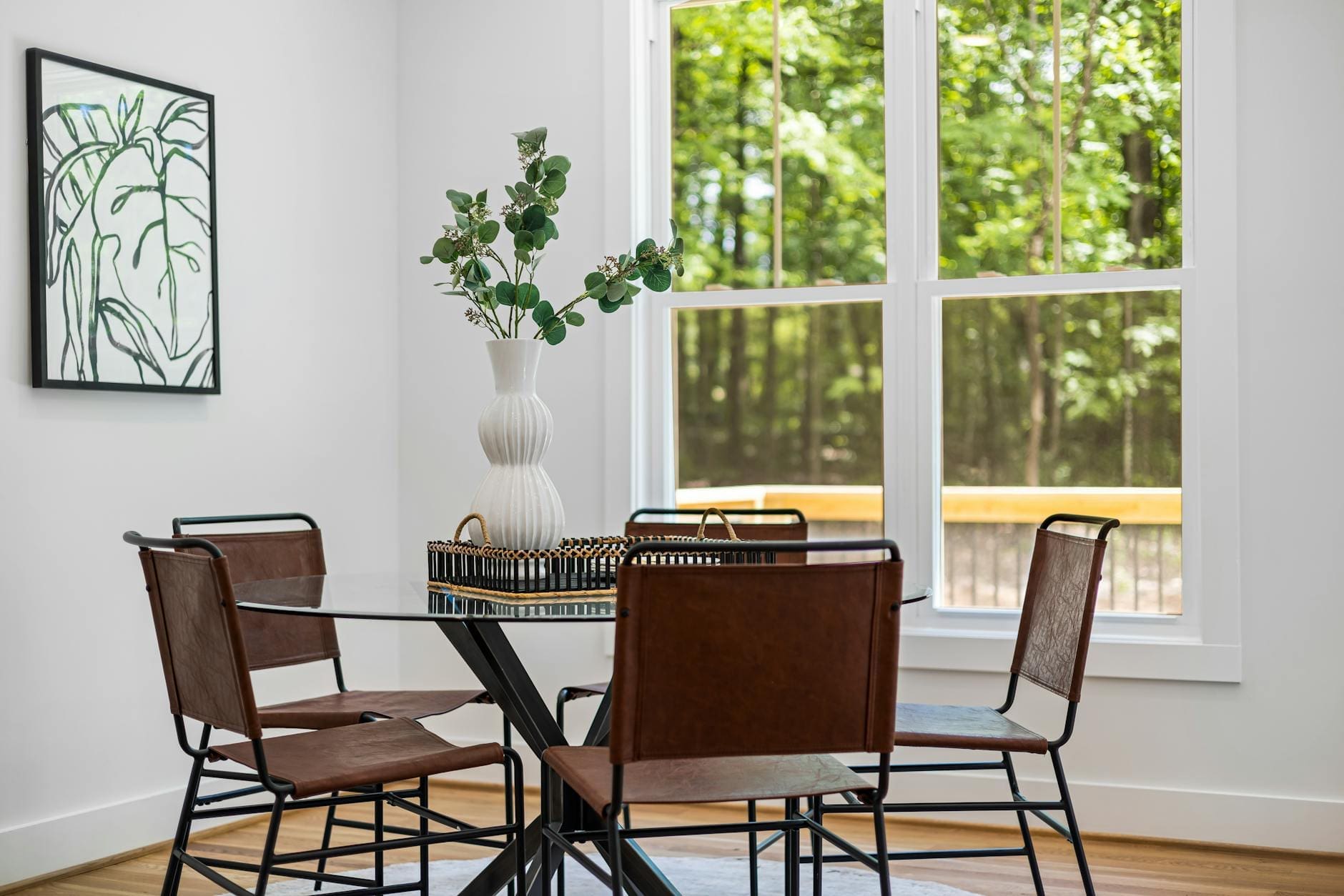 https://www.pexels.com/photo/table-with-plant-and-chairs-near-windows-16641330/