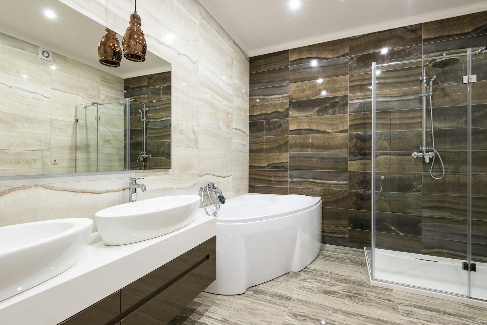 Contemporary bathroom design featuring sleek white fixtures and stylish tiles.