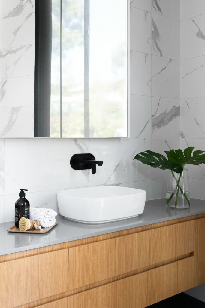 white ceramic sink with faucet