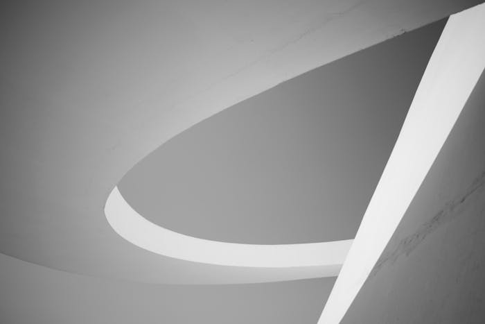 Monochrome abstract view of geometric shapes in modern architecture ceiling design.