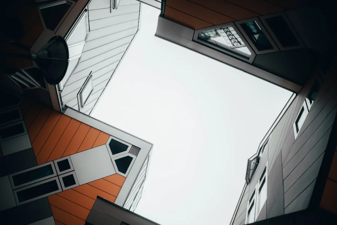 Worm's eye view of cube houses showing geometric corners and angular architecture in Rotterdam