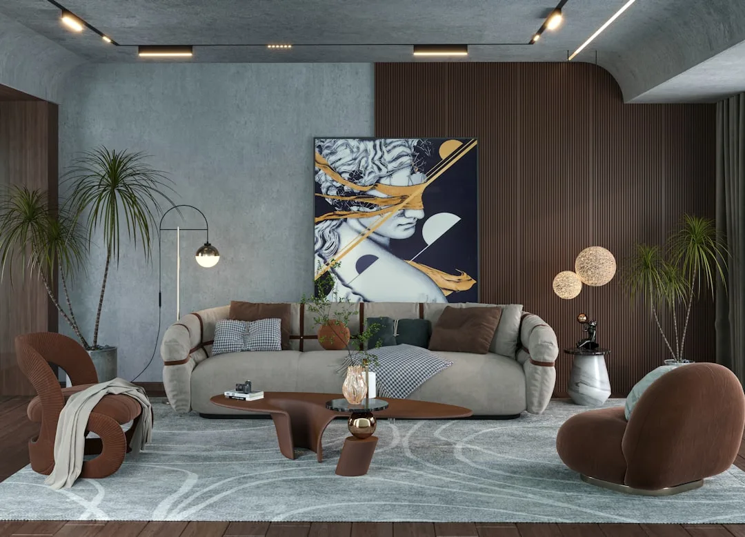 Contemporary living room with earth-toned neutrals, taupe sofa, brown chairs, and warm gray concrete walls in Japandi-in