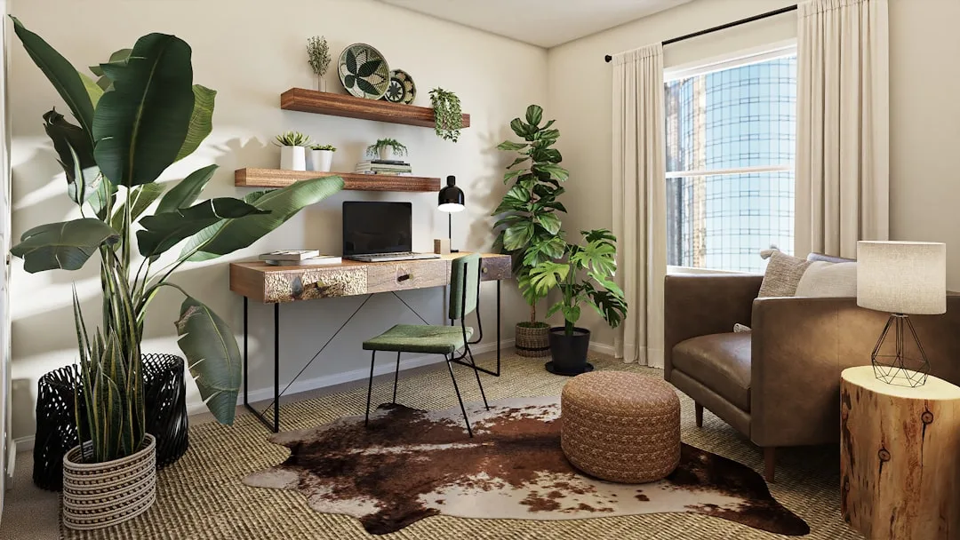Rustic floating wood desk with laptop and wall shelves in a boho home office with plants and leather chair