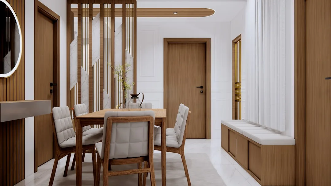 Modern dining room with wooden table, upholstered chairs, and warm wood accents for budget-conscious interior design