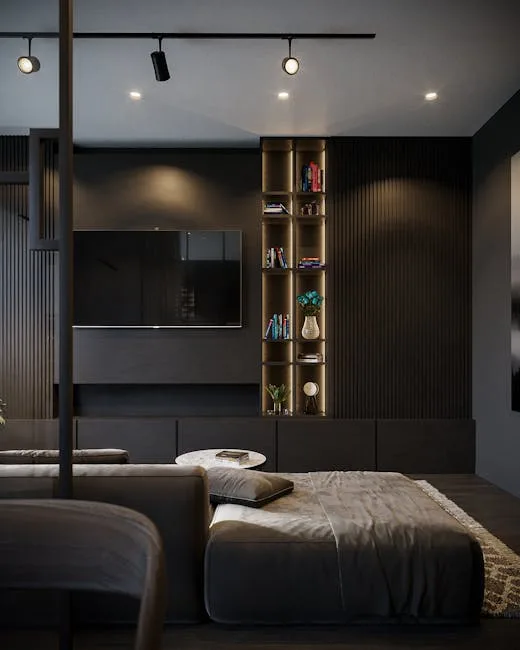 Dark aesthetic living room with charcoal walls, track lighting, illuminated shelving unit, flat-screen TV, and plush sof