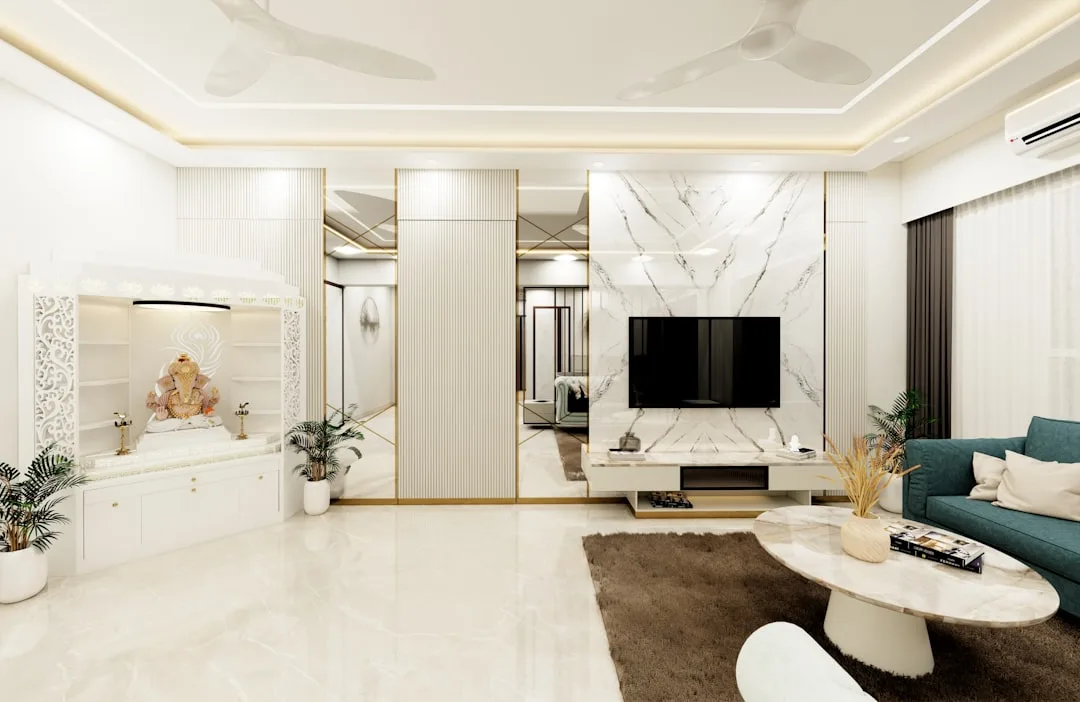 Spacious luxury living room with marble walls, gold accents, Ganesha shrine, teal sofa and large open floor plan