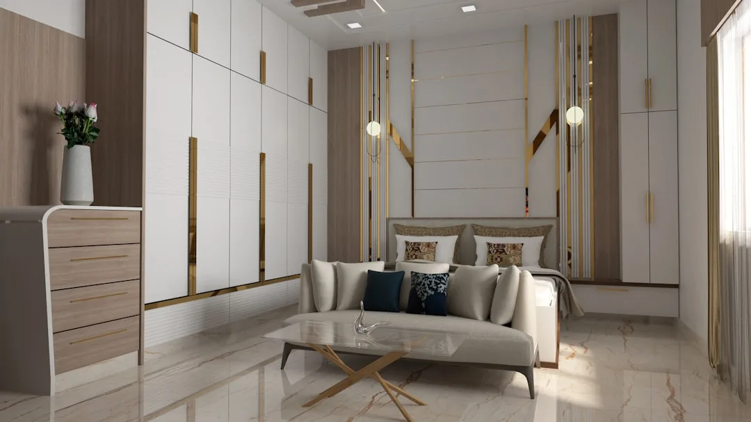 Luxury master bedroom layout with centered bed, built-in wardrobes, sofa seating area, and gold accent wall decor