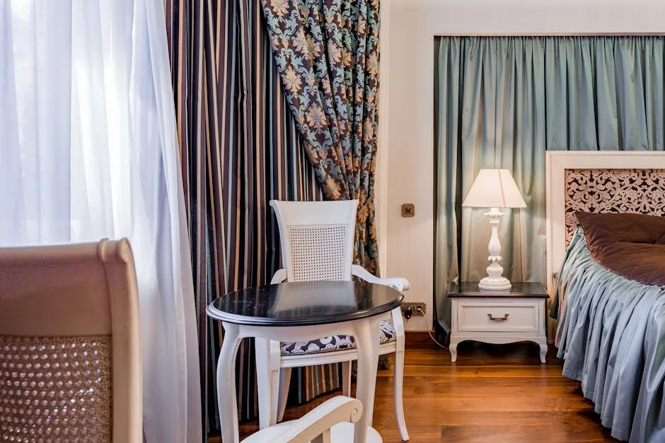 Elegant bedroom with teal blackout curtains and sheer white privacy curtains layered on windows