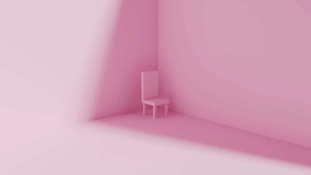Minimalist pink room with a single pink chair in the corner showing intentional monochromatic interior design