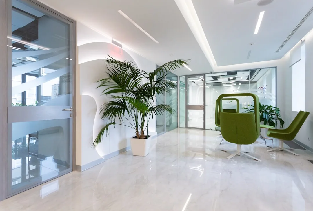 Glass-paneled office corridor door with modern interior showing soundproofing partition walls and acoustic design