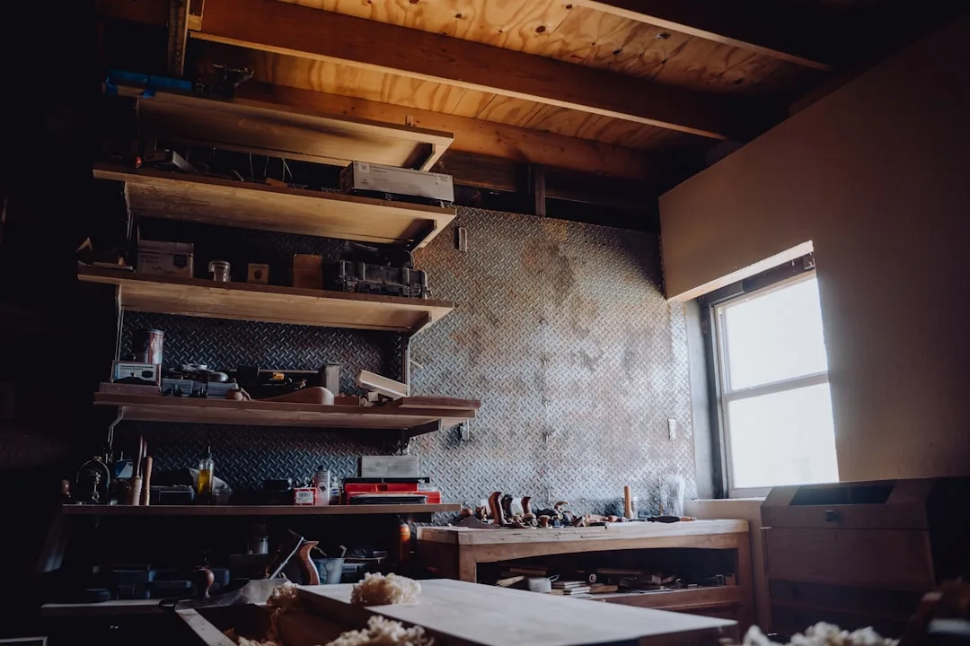 Rustic DIY woodworking workshop with wooden shelves holding tools and supplies, illustrating homemade shelf building cos