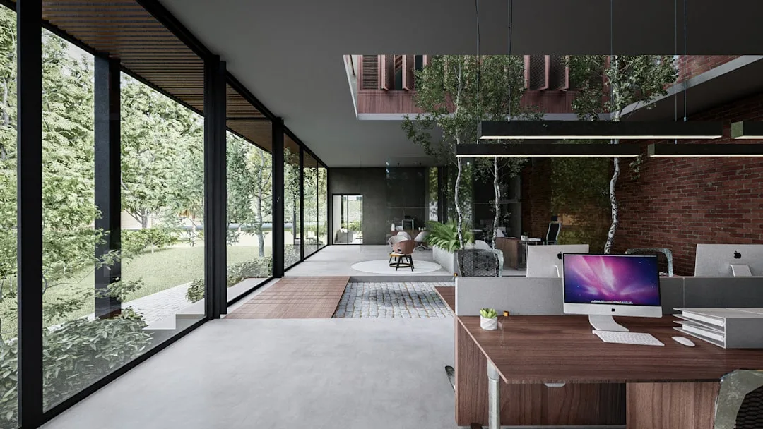 Modern open-plan office with clear traffic flow paths, floor-to-ceiling windows, and defined conversation zones