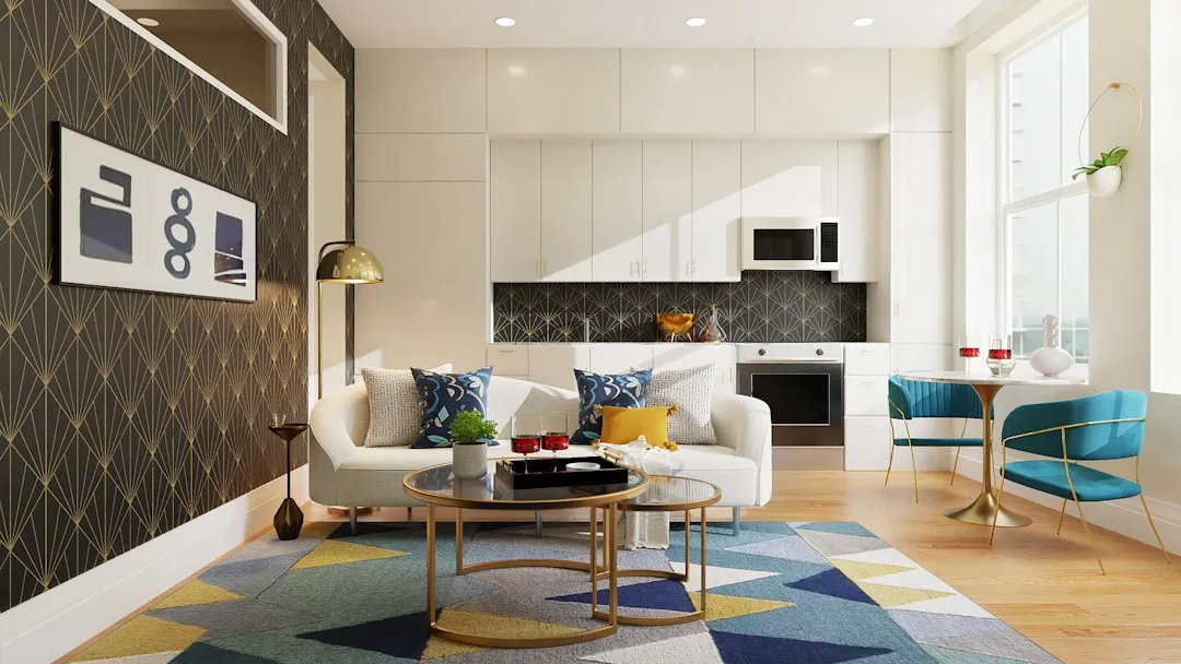 Modern living room with geometric patterned wallpaper, multicolor rug, and bold accent pillows showing pattern layering