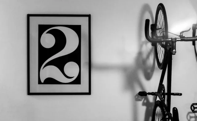 Framed black and white number 2 wall art displayed