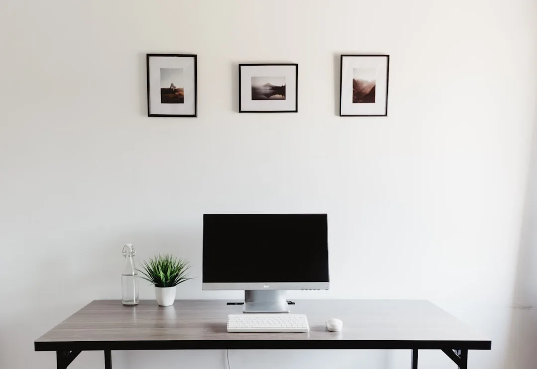 Minimalist freestanding desk with monitor, keyboar