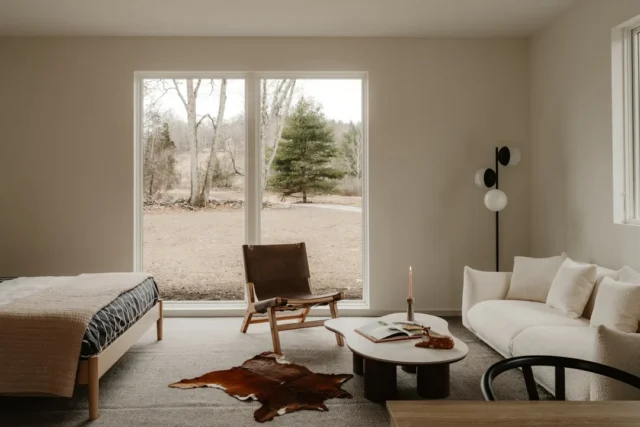 Modern living space with large window overlooking nature