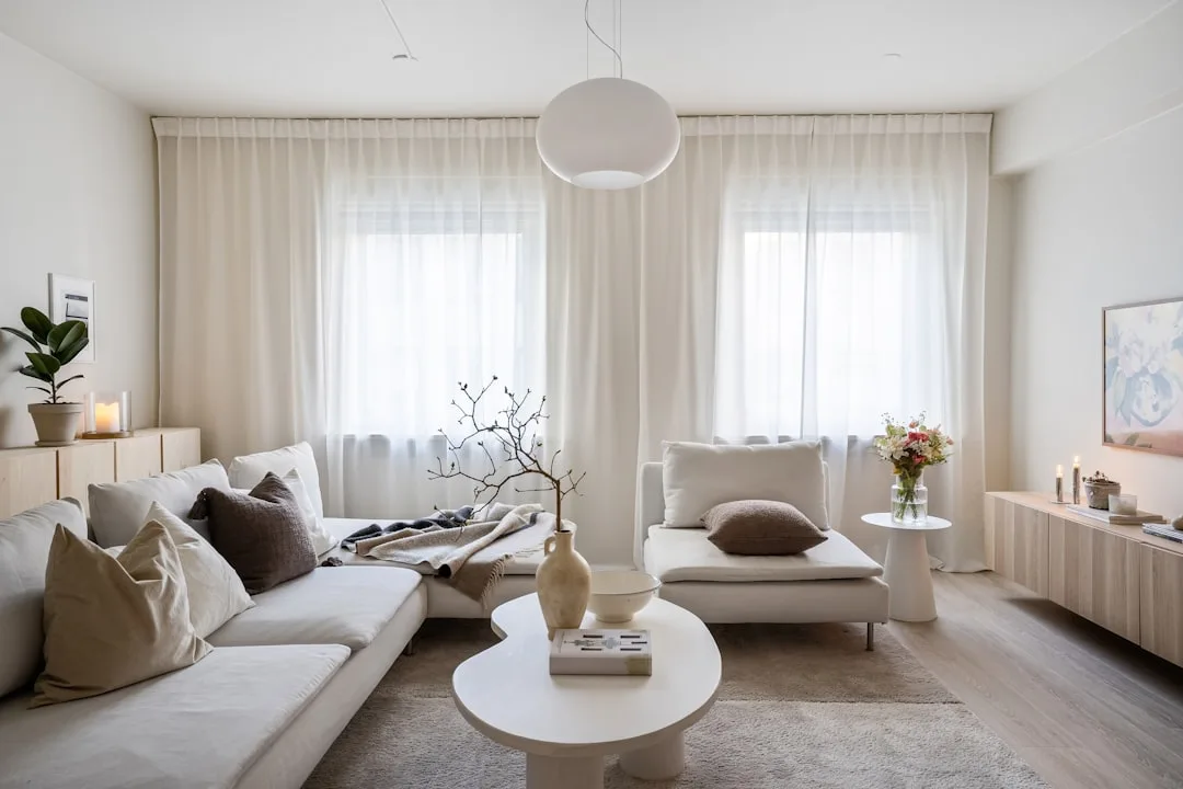 Scandinavian living room with neutral beige and wh