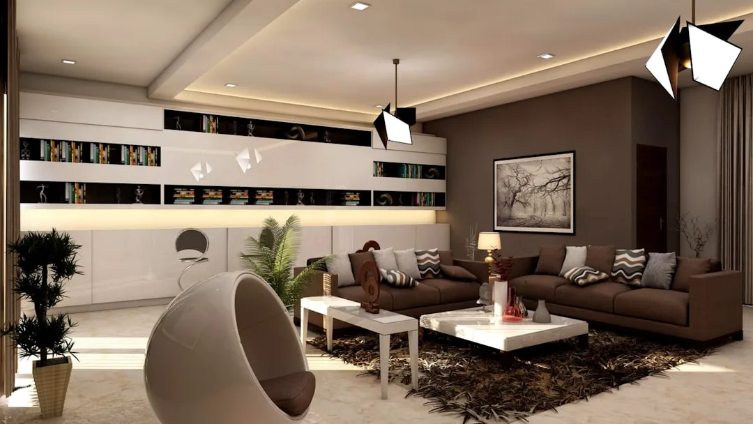 Chocolate brown living room with cream accents, geometric pendant lights, white built-in shelving and egg chair