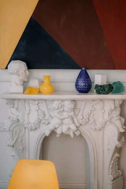 Ornate white rococo fireplace mantel with colorful Jonathan Adler-style ceramic vases and decorative objects