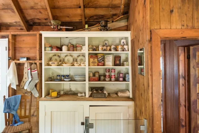 Vintage farmhouse pantry cabinet with antique cann
