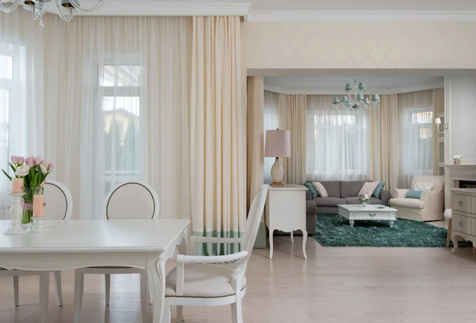 Elegant coquette-style living and dining room with cream curtains, white ornate furniture, tulips, and teal accents