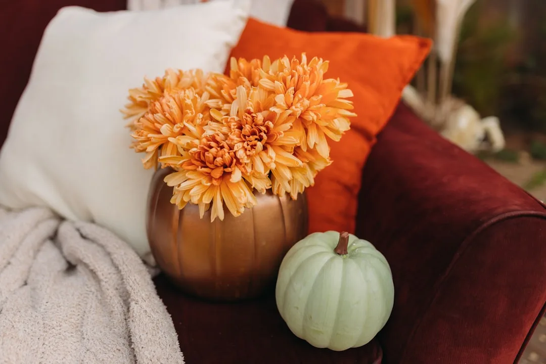 Budget fall decor with orange chrysanthemums in br