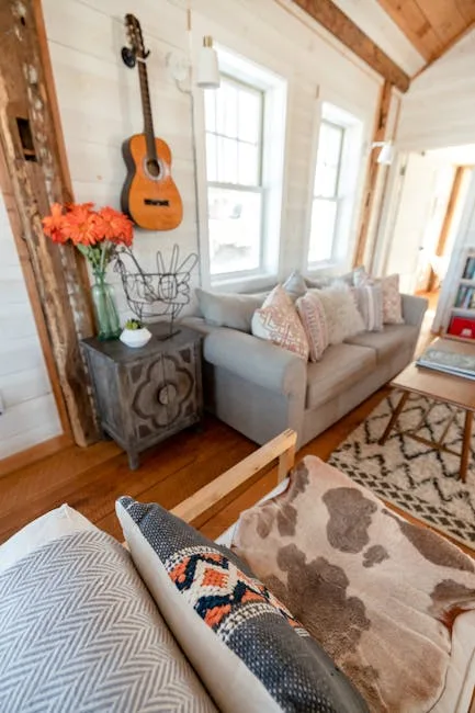 Cozy farmhouse living room with shiplap walls, aco