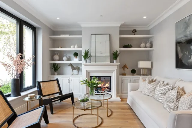 Living room with white fireplace as focal point, b