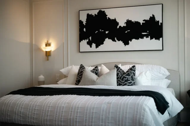 Large black and white abstract artwork hanging abo