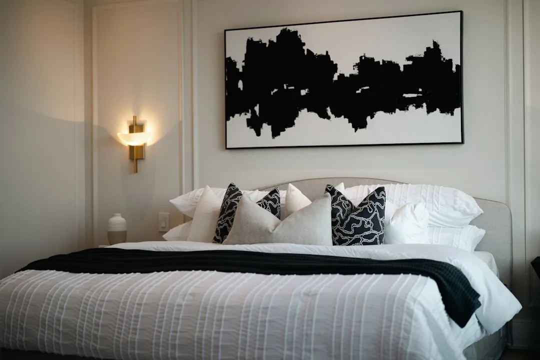 Large black and white abstract artwork hanging abo