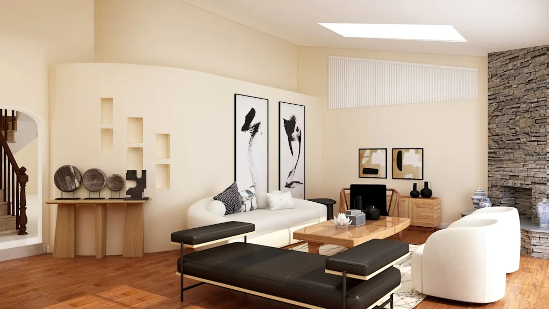 Budget-friendly modern living room with white sofa, wood coffee table, black leather benches and thrifted decor pieces