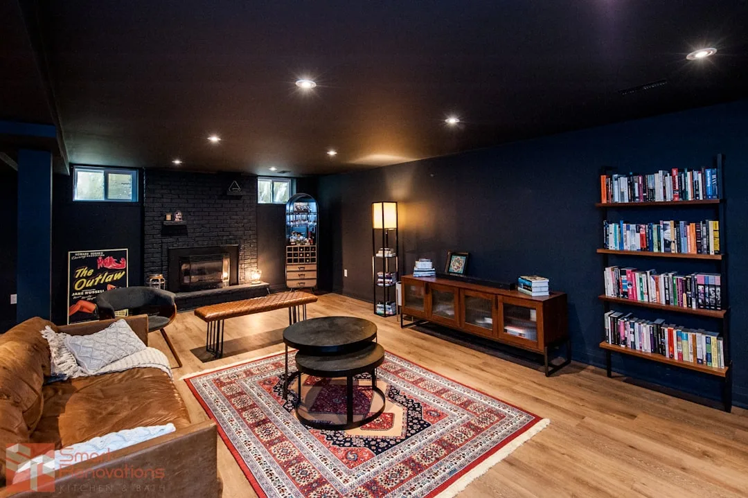 Finished basement living room with dark navy walls