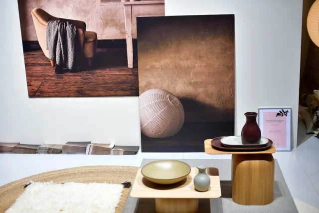 Japandi-style display with wooden side tables, cer