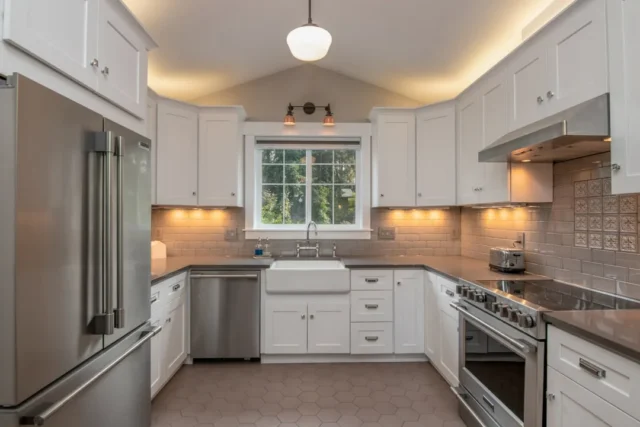 Renovated white shaker kitchen with stainless stee