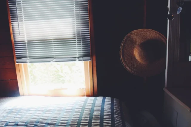 Bedroom window with partially closed horizontal bl