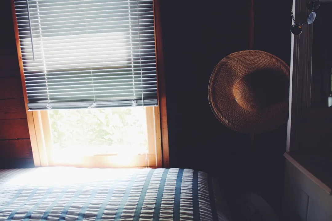 Bedroom window with partially closed horizontal bl