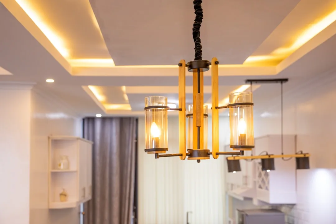 Rustic wood and metal chandelier with glass cylind