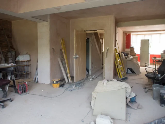 Interior renovation in progress with exposed plast