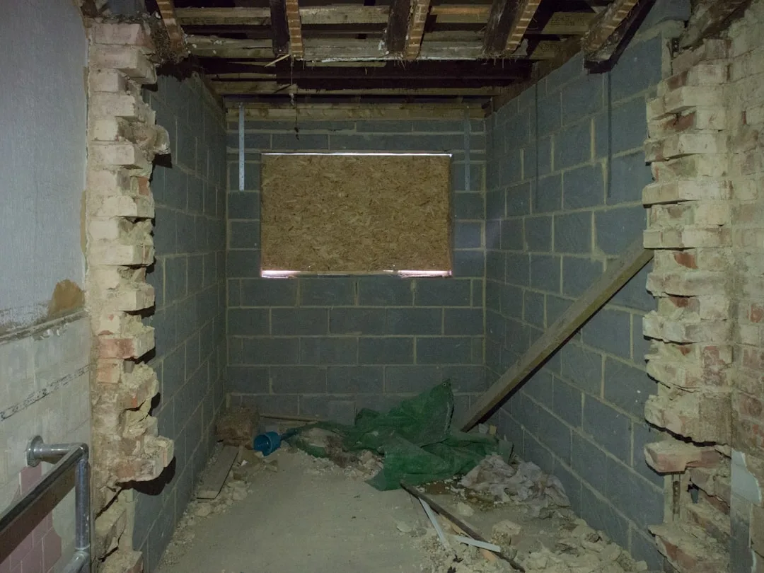 Unfinished basement with exposed cinder block wall