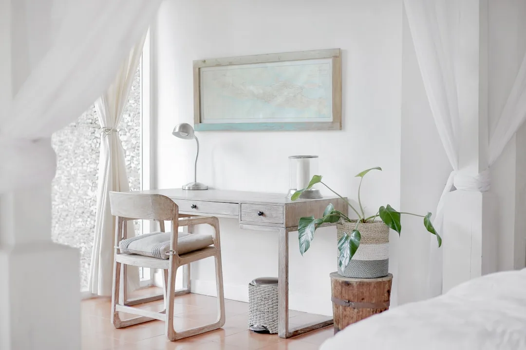 Minimalist bedroom workspace with whitewashed wood