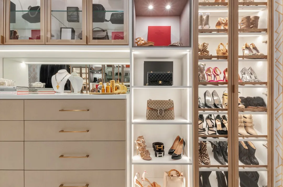 Luxury custom closet with illuminated shelves disp