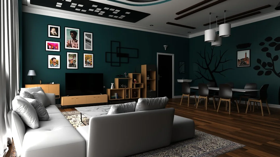 Open-plan living room with open shelving room divider, teal walls, white sofa and dining area
