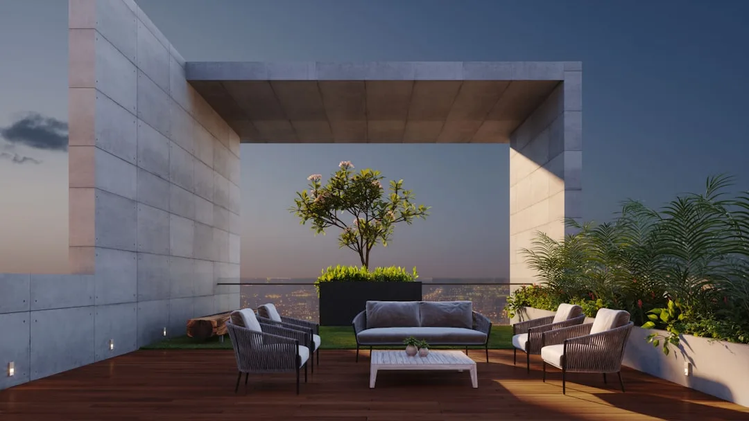 Modern rooftop terrace with micro-zone seating area, rope chairs, sofa, wood deck and city skyline at dusk