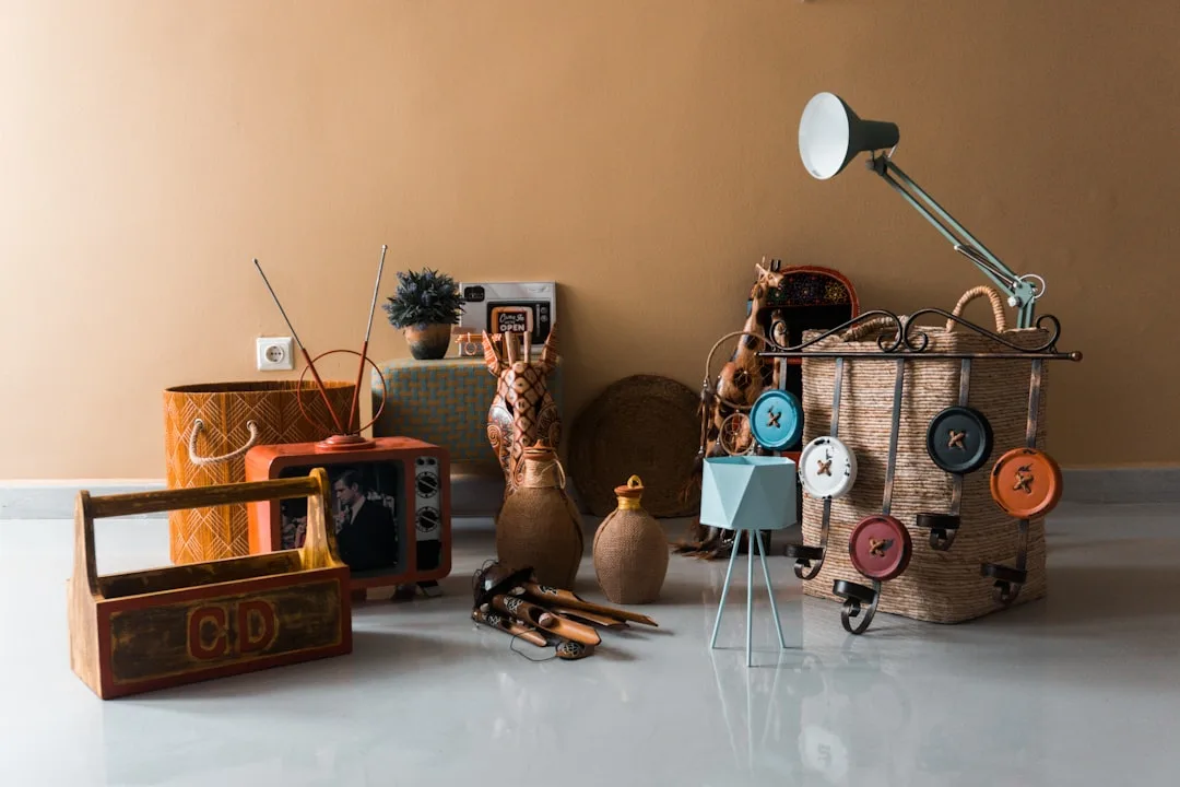Woven baskets and decorative containers with assigned purposes holding various small items and objects on a floor